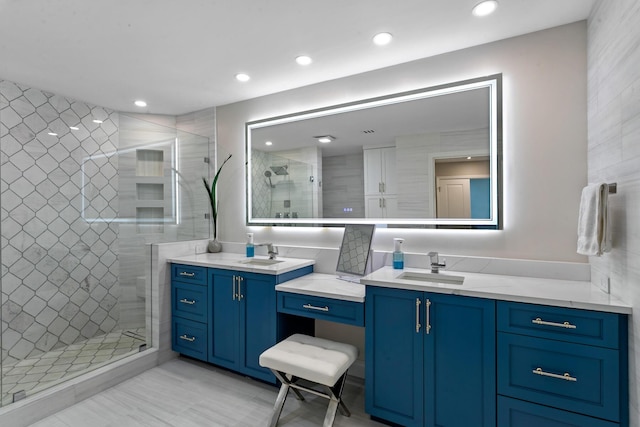 bathroom with vanity and walk in shower