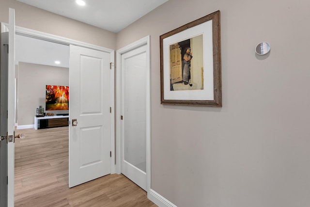 corridor featuring light wood-type flooring