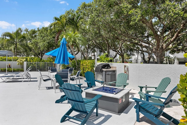 view of patio / terrace with an outdoor fire pit