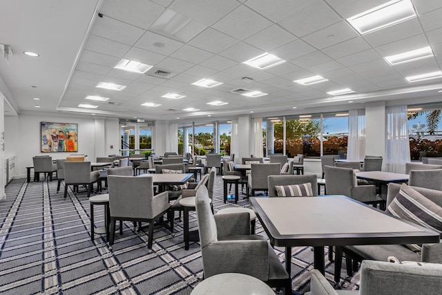 carpeted dining room with a wealth of natural light