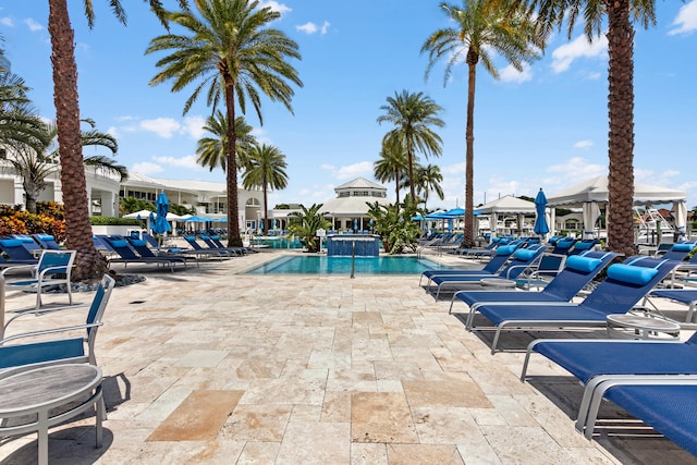 view of swimming pool featuring a patio area