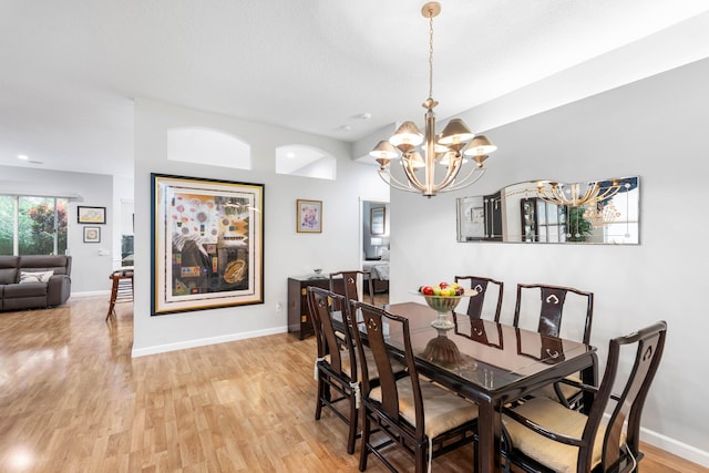 dining room featuring a chandelier and light hardwood / wood-style floors