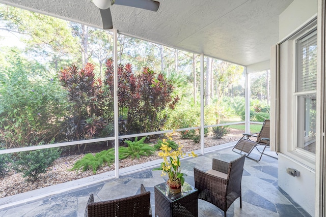 sunroom / solarium with ceiling fan