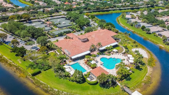 birds eye view of property with a water view