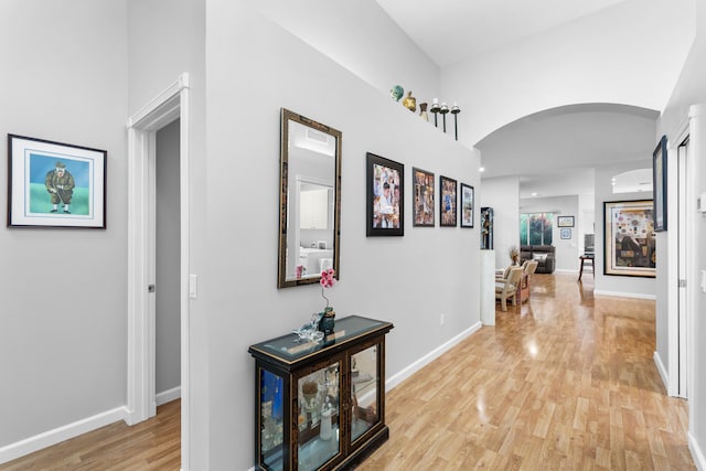 hallway with light hardwood / wood-style floors