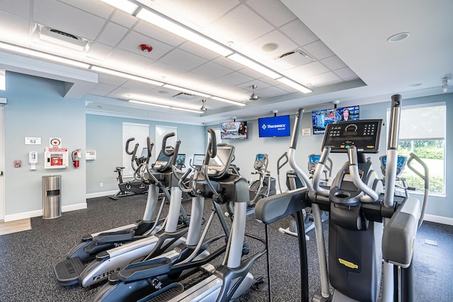 workout area featuring a paneled ceiling