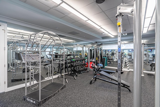 exercise room featuring a drop ceiling