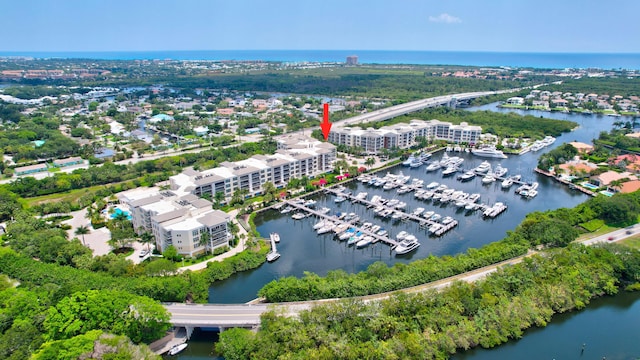 birds eye view of property with a water view