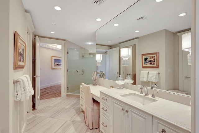 bathroom featuring vanity and walk in shower