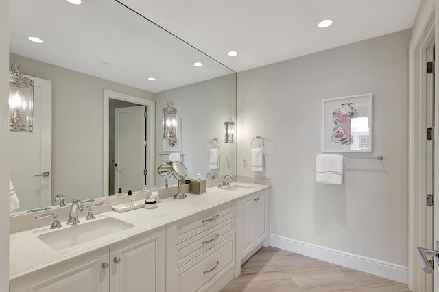 bathroom featuring tile patterned flooring and vanity