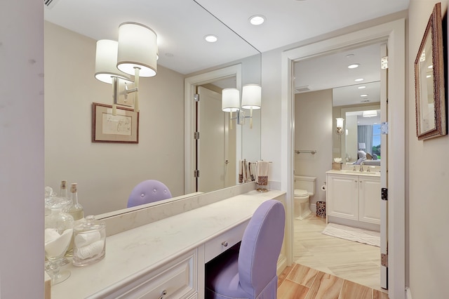 bathroom with vanity and toilet