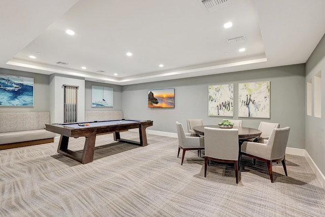 recreation room featuring light carpet, a tray ceiling, and billiards