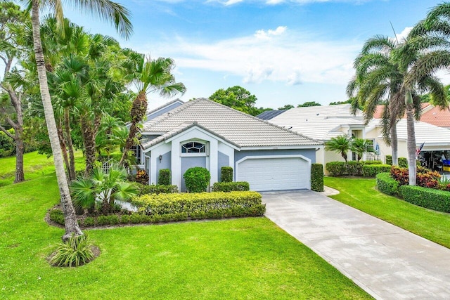 view of front of home featuring a garage and a front lawn