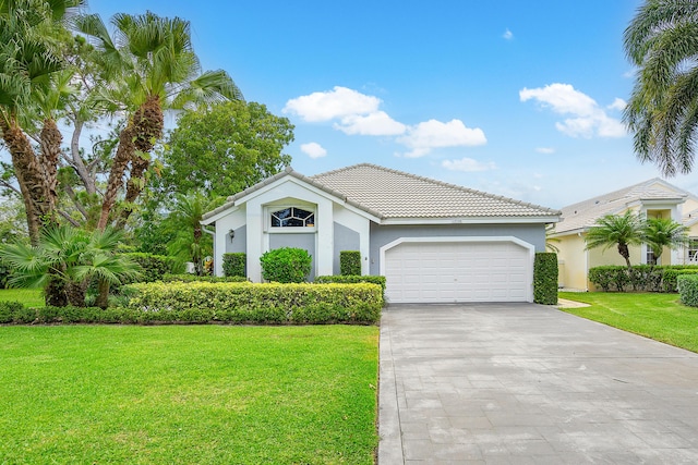 view of front of home featuring a garage and a front yard