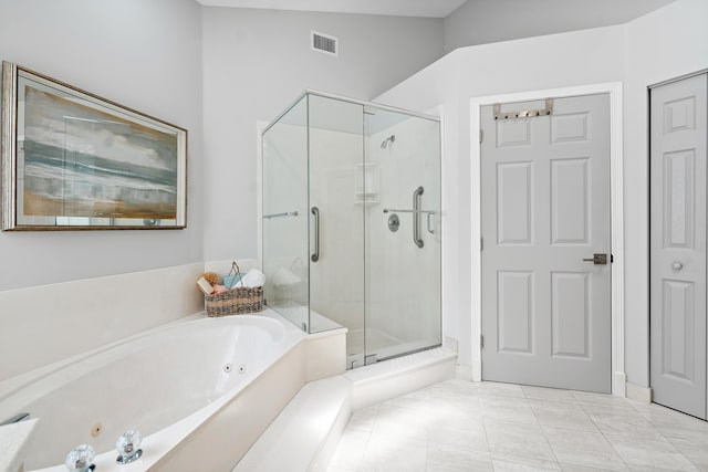 bathroom with tile patterned floors, independent shower and bath, and lofted ceiling