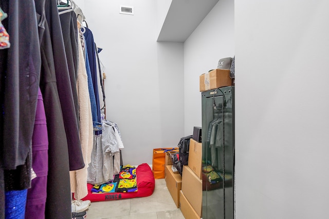 walk in closet featuring light tile patterned floors