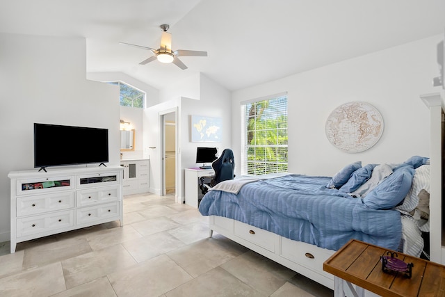 tiled bedroom with ensuite bath, ceiling fan, and lofted ceiling