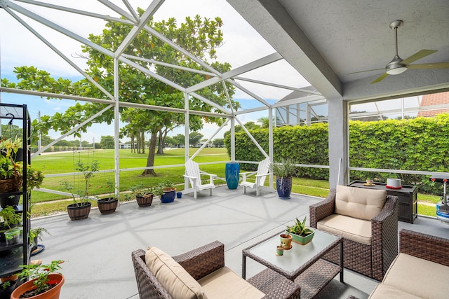 view of patio / terrace with a lanai and ceiling fan