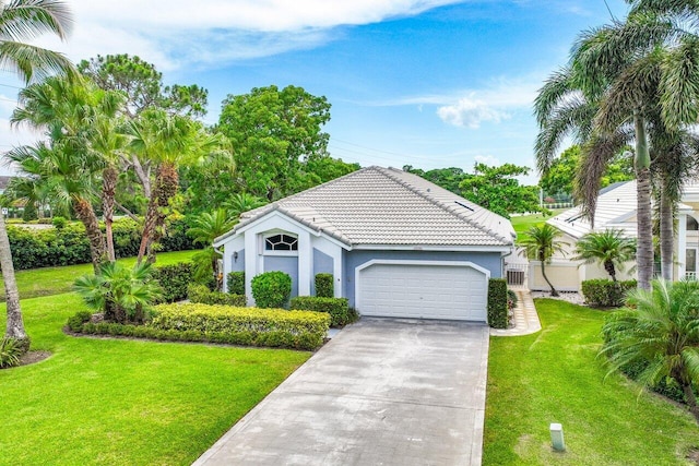 view of front of house with a garage and a front yard