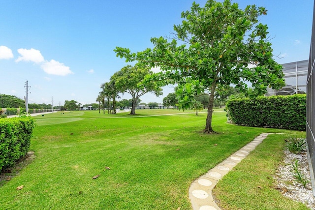 view of yard featuring glass enclosure