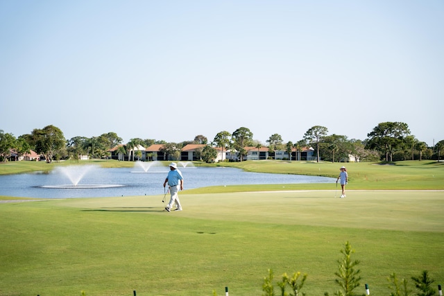 surrounding community featuring a water view