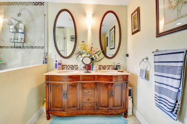 bathroom featuring tile patterned flooring and vanity