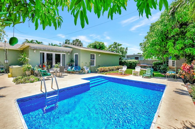 view of pool featuring a patio