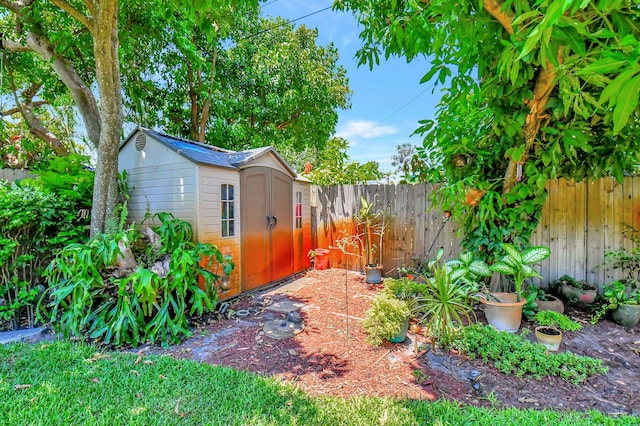 view of yard featuring a storage unit