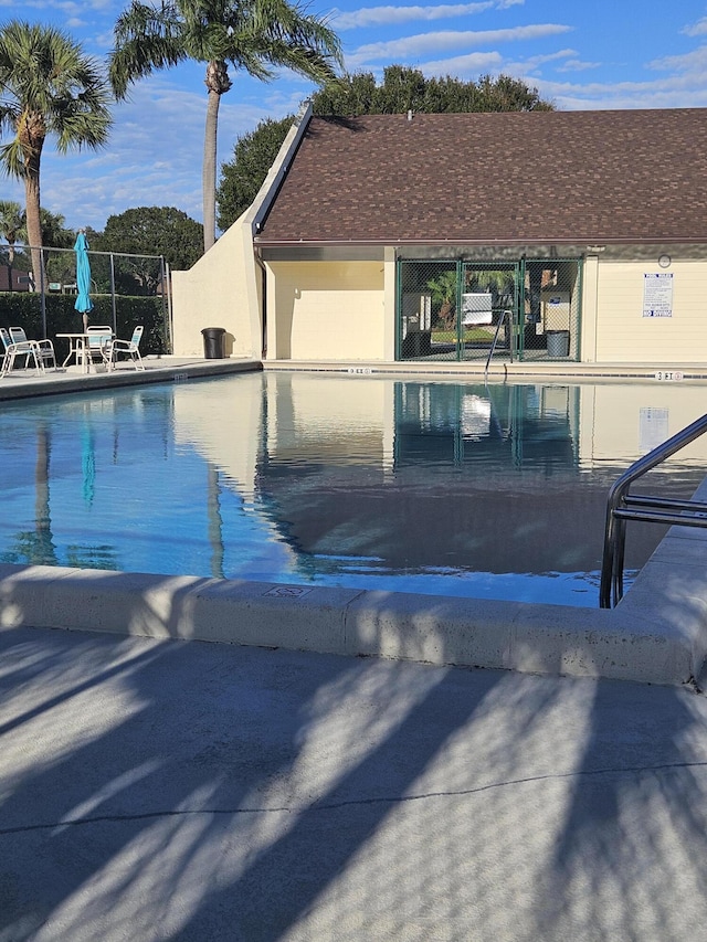 view of swimming pool with a patio