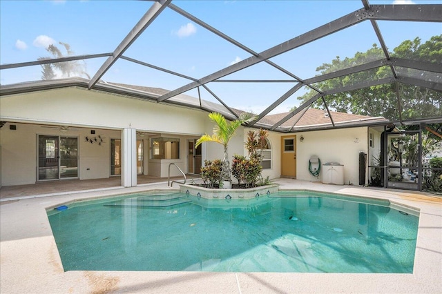 view of pool featuring a lanai, a patio area, and ceiling fan