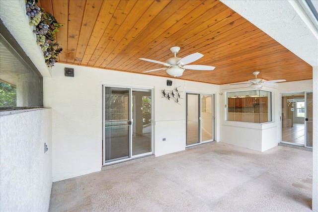 exterior space with ceiling fan