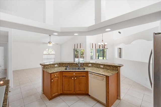 kitchen featuring dishwasher, ceiling fan with notable chandelier, sink, decorative light fixtures, and stainless steel refrigerator