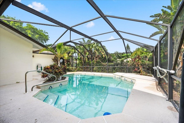 view of pool with a lanai and a patio