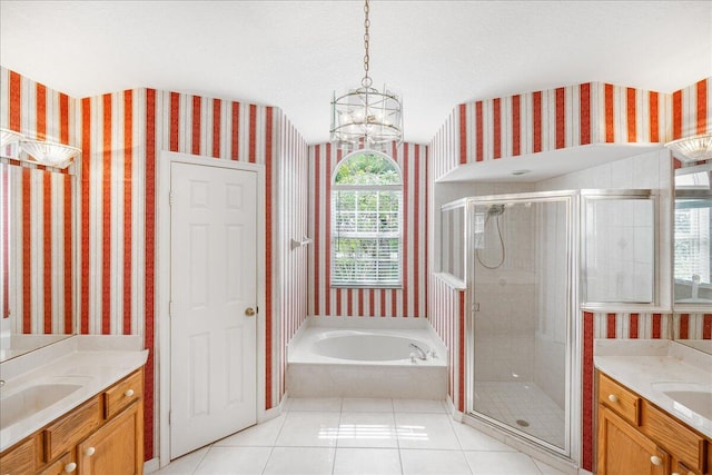 bathroom with vanity, an inviting chandelier, tile patterned floors, and independent shower and bath