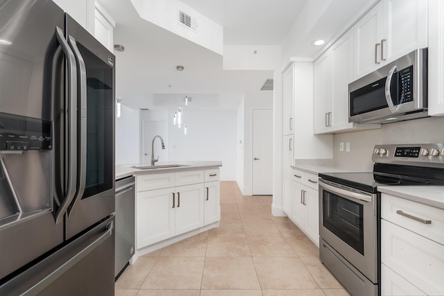 kitchen featuring white cabinetry, sink, and appliances with stainless steel finishes