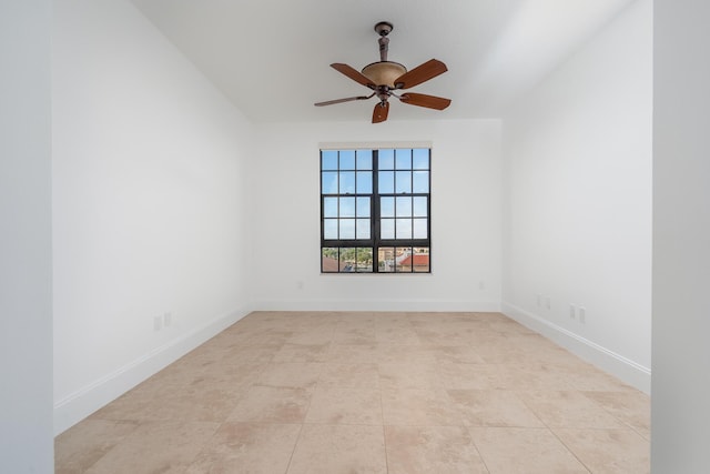 unfurnished room with ceiling fan and light tile patterned floors