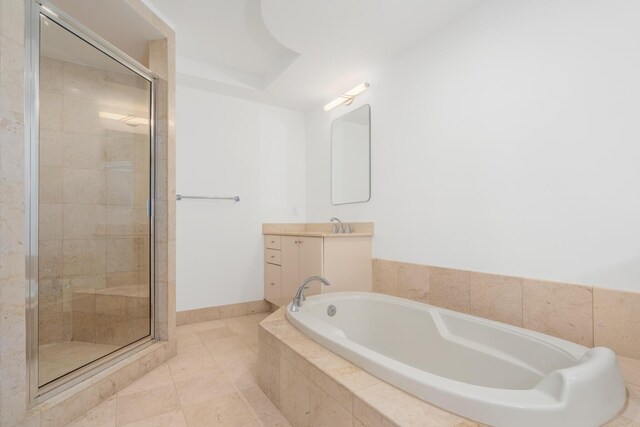 bathroom featuring tile patterned floors, vanity, and independent shower and bath