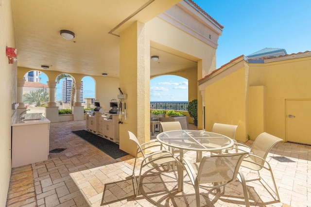 view of patio / terrace featuring area for grilling and sink