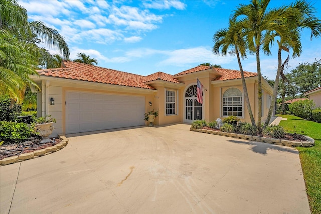 mediterranean / spanish-style home featuring a garage