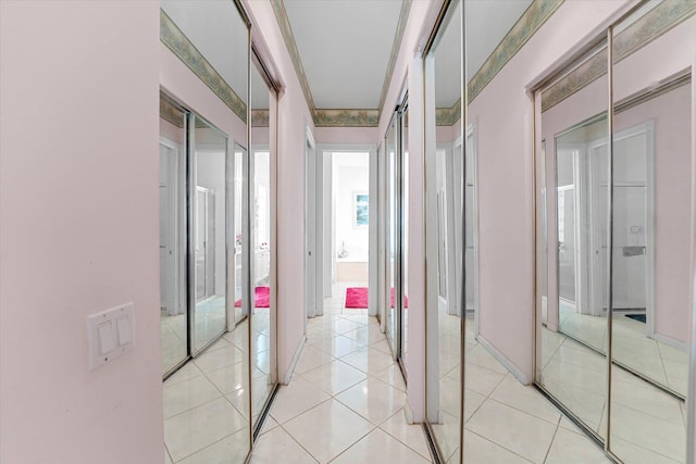 hall featuring light tile patterned flooring