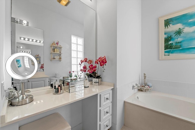 bathroom featuring a bath and vanity