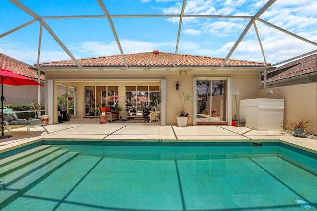 view of pool featuring a patio area and a lanai