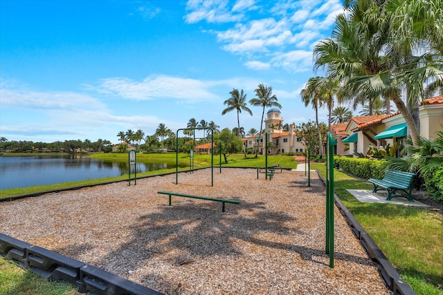 view of jungle gym with a water view and a yard