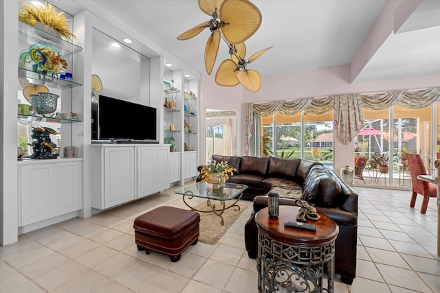 living room with ceiling fan and light tile patterned floors