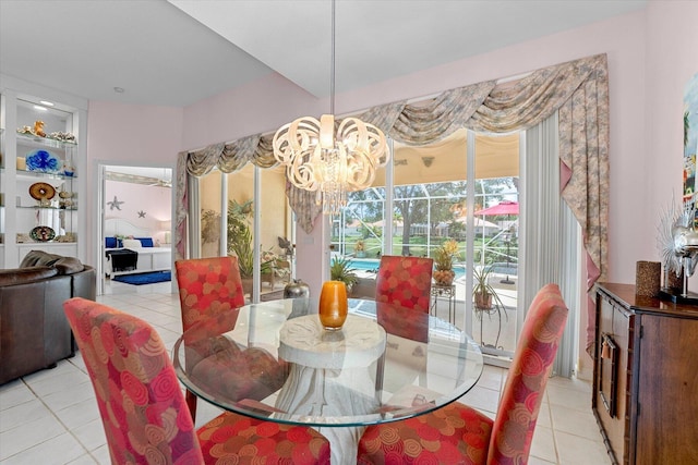 tiled dining area with a notable chandelier