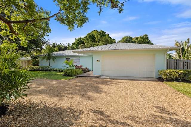 ranch-style house featuring a garage