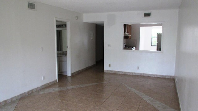 view of tiled spare room