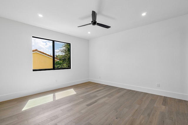 unfurnished room with ceiling fan and light hardwood / wood-style flooring