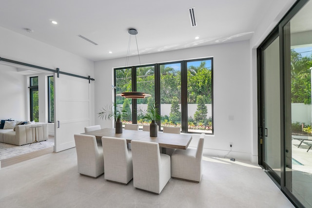 dining area with a barn door