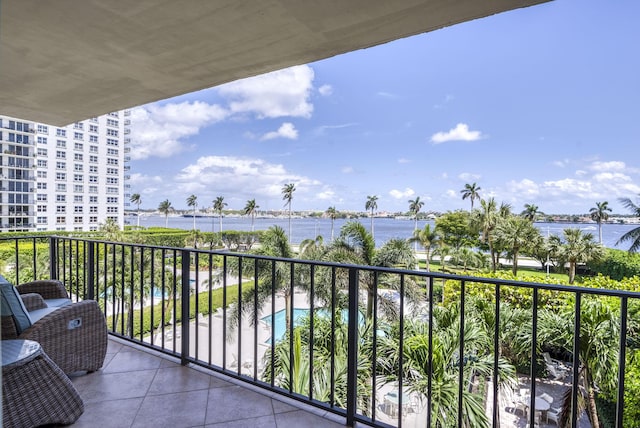 balcony featuring a water view